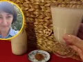 Kobieta z uśmiechem prezentuje szklankę z wodą owsianą, obok butelka i cynamon.