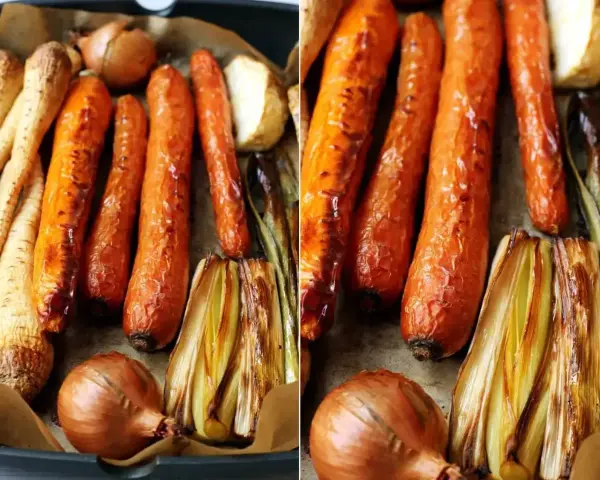 Pieczone warzywa: marchewki, pasternak, cebula i por, gotowe do przygotowania aromatycznego rosół z pieczonych warzyw.